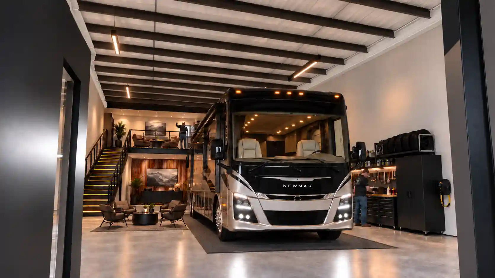 Rendering of a bay set up as a private RV garage with a mezzanine lounge and a tool wall